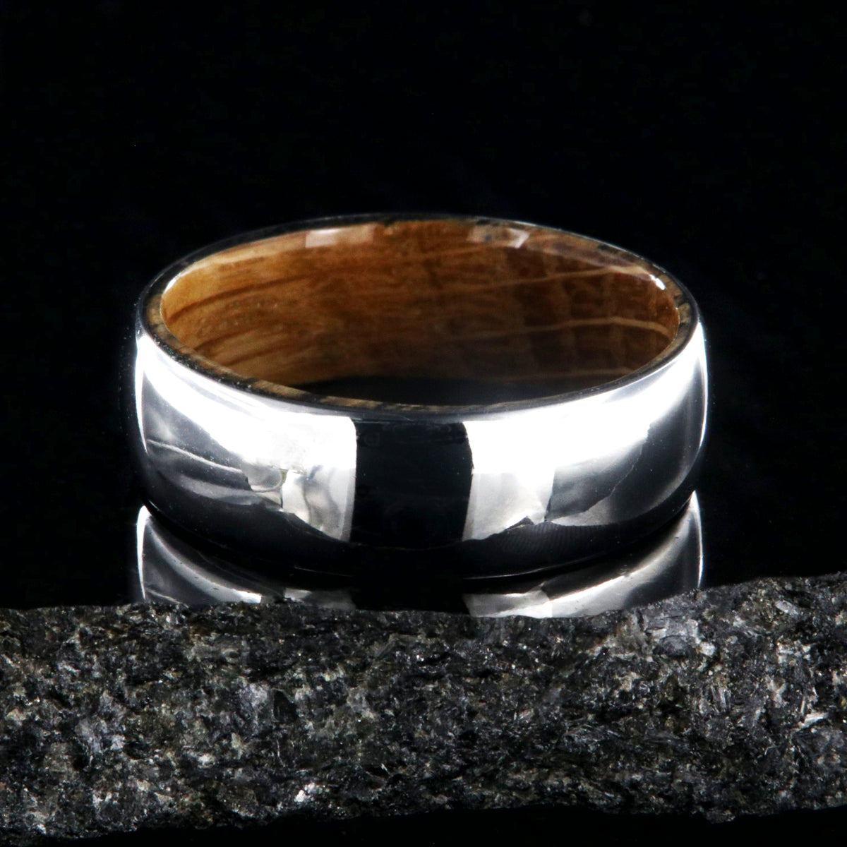 7mm wide cobalt wedding ring with a high polish and whiskey barrel sleeve