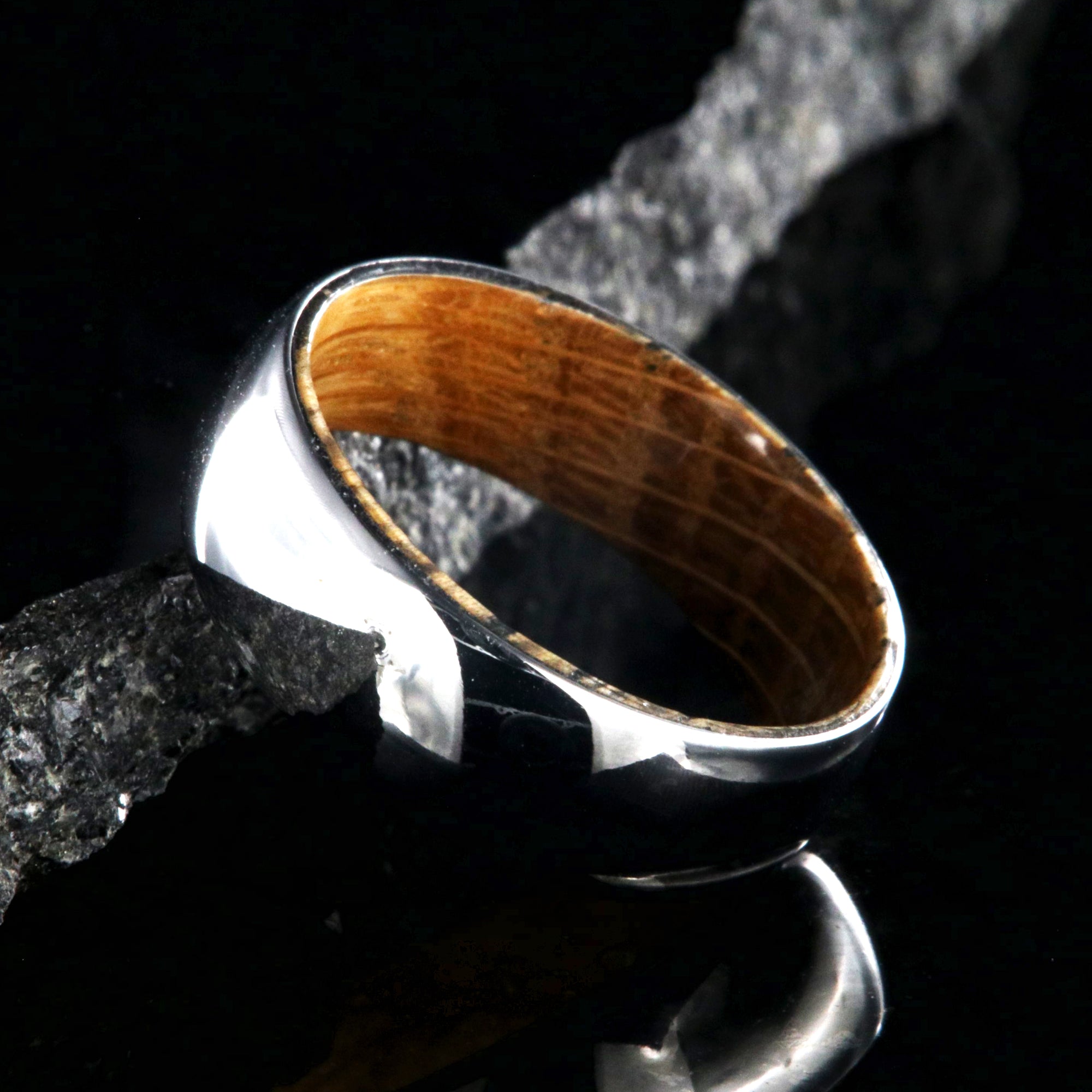 7mm wide cobalt wedding ring with a high polish and whiskey barrel sleeve