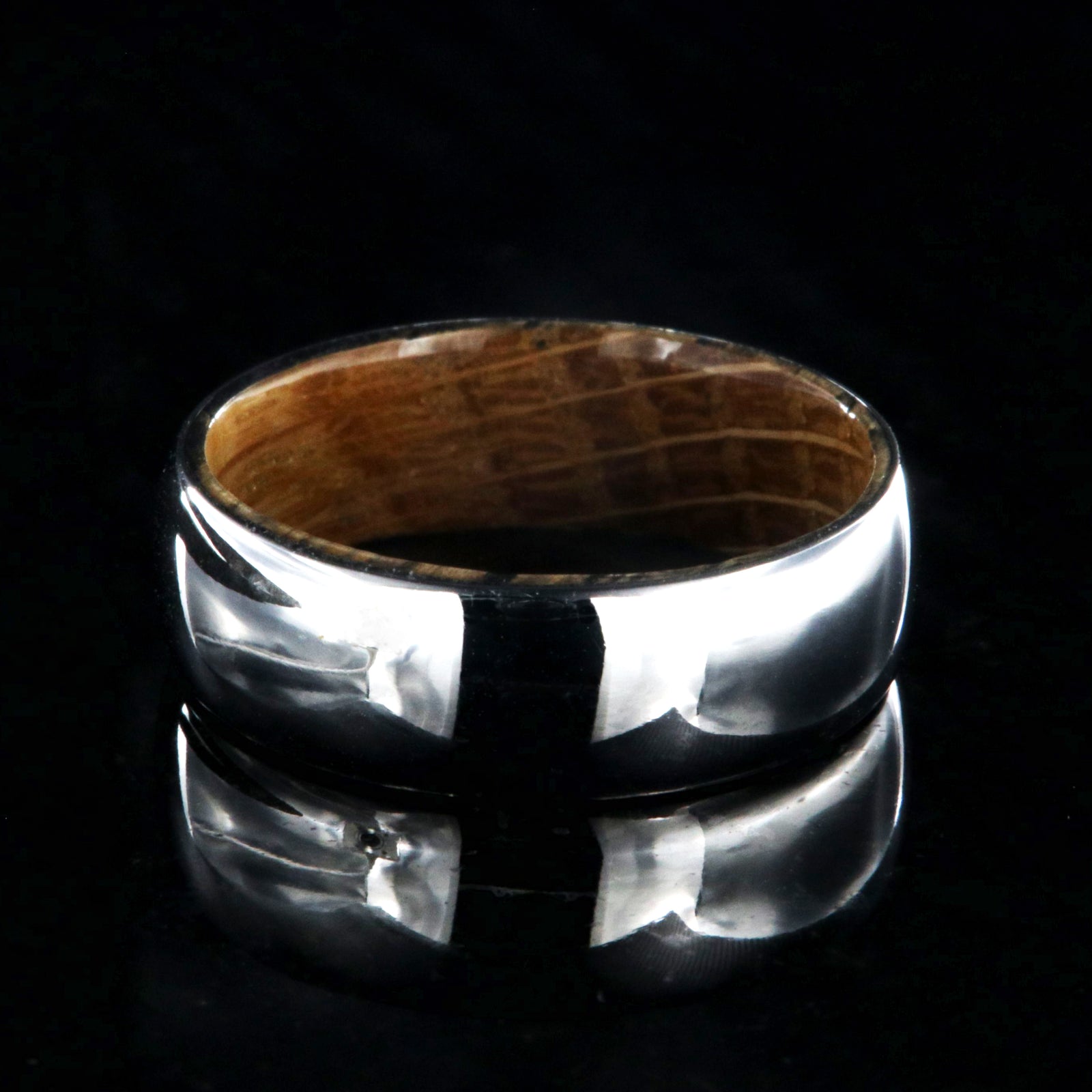 7mm wide cobalt wedding ring with a high polish and whiskey barrel sleeve