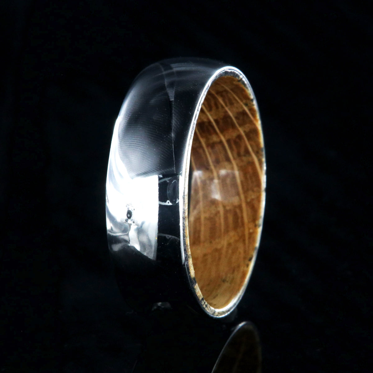 7mm wide cobalt wedding ring with a high polish and whiskey barrel sleeve
