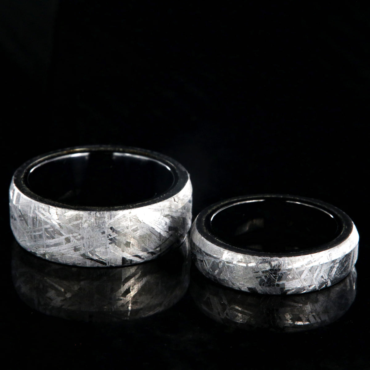 8mm and 5mm matching wedding ring set made with Gibeon meteorite and black titanium sleeves with beveled edges