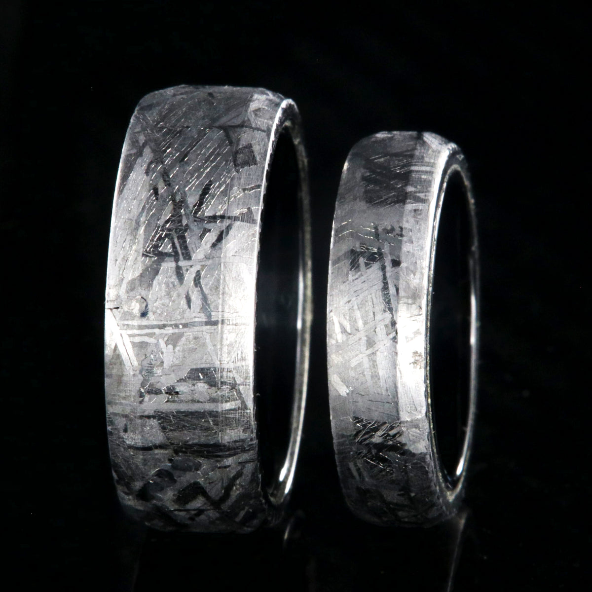 8mm and 5mm matching wedding ring set made with Gibeon meteorite and black titanium sleeves with beveled edges