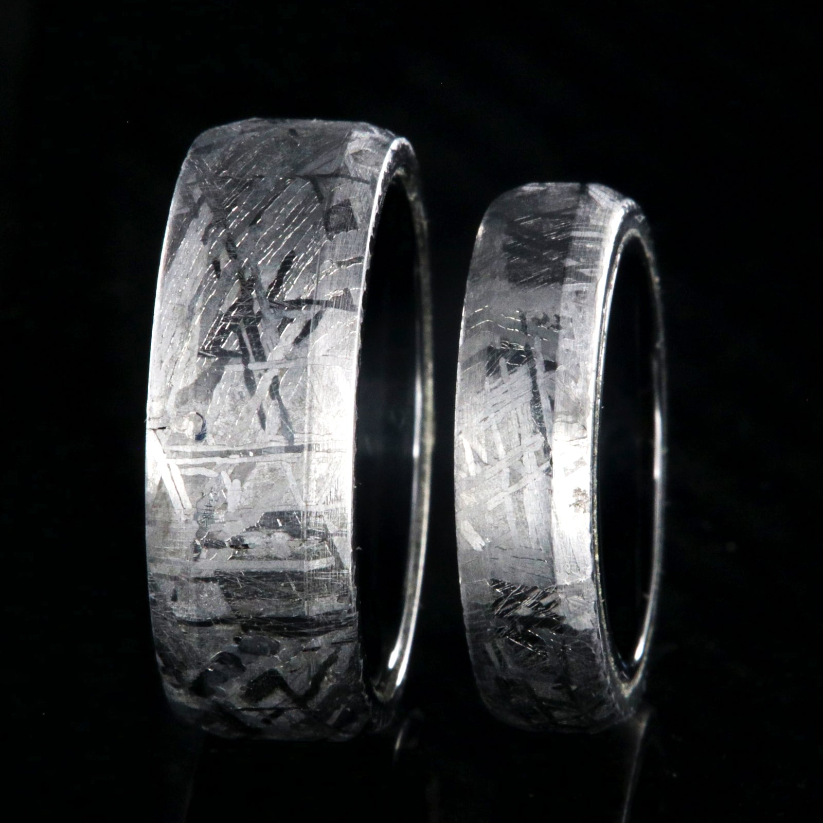 8mm and 5mm matching wedding ring set made with Gibeon meteorite and black titanium sleeves with beveled edges