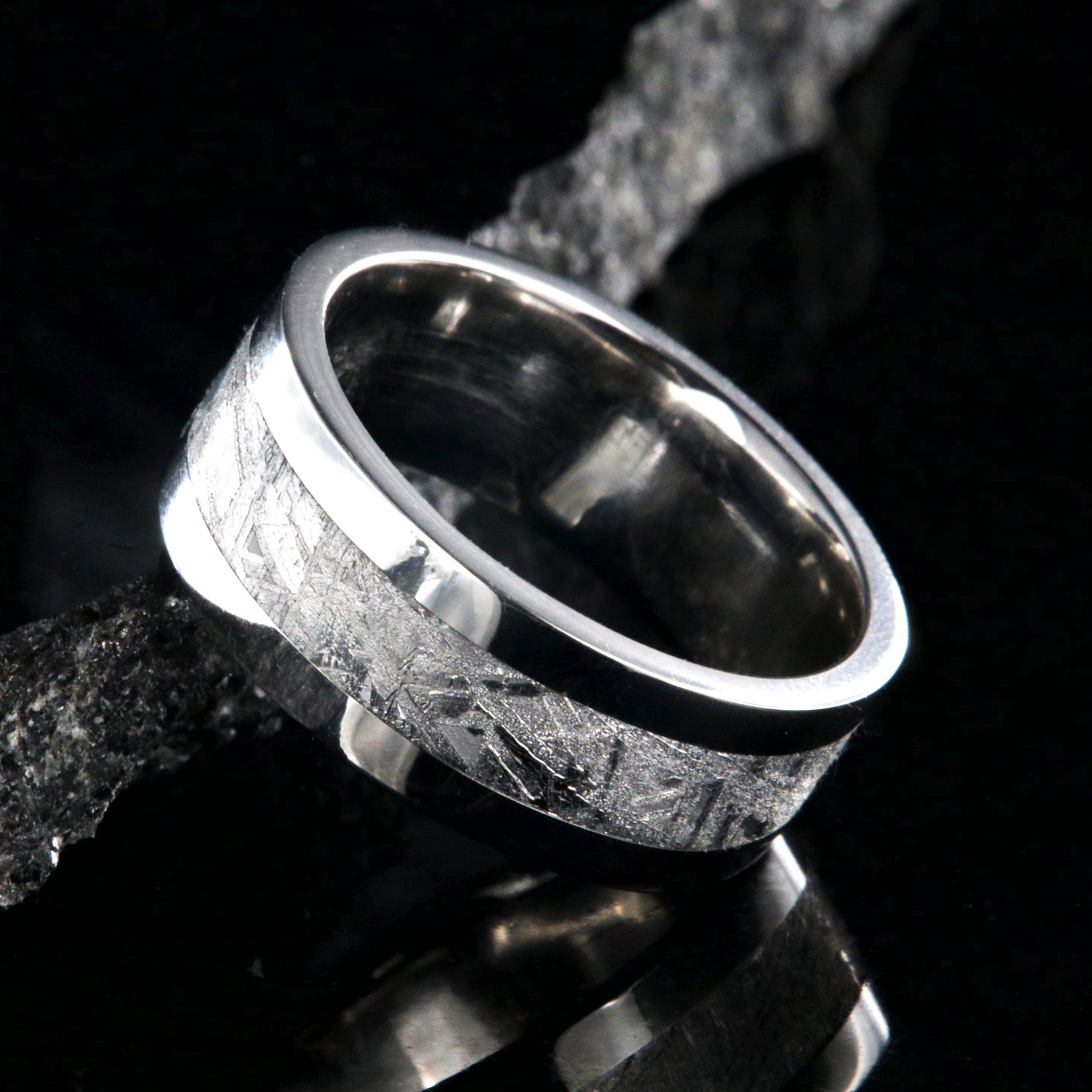 8mm wide men's wedding ring with a center of Gibeon meteorite and wide polished cobalt edges and sleeve