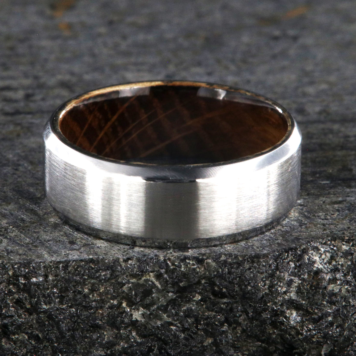 8mm wide cobalt ring with a brushed finish, beveled edges, and a whiskey barrel sleeve