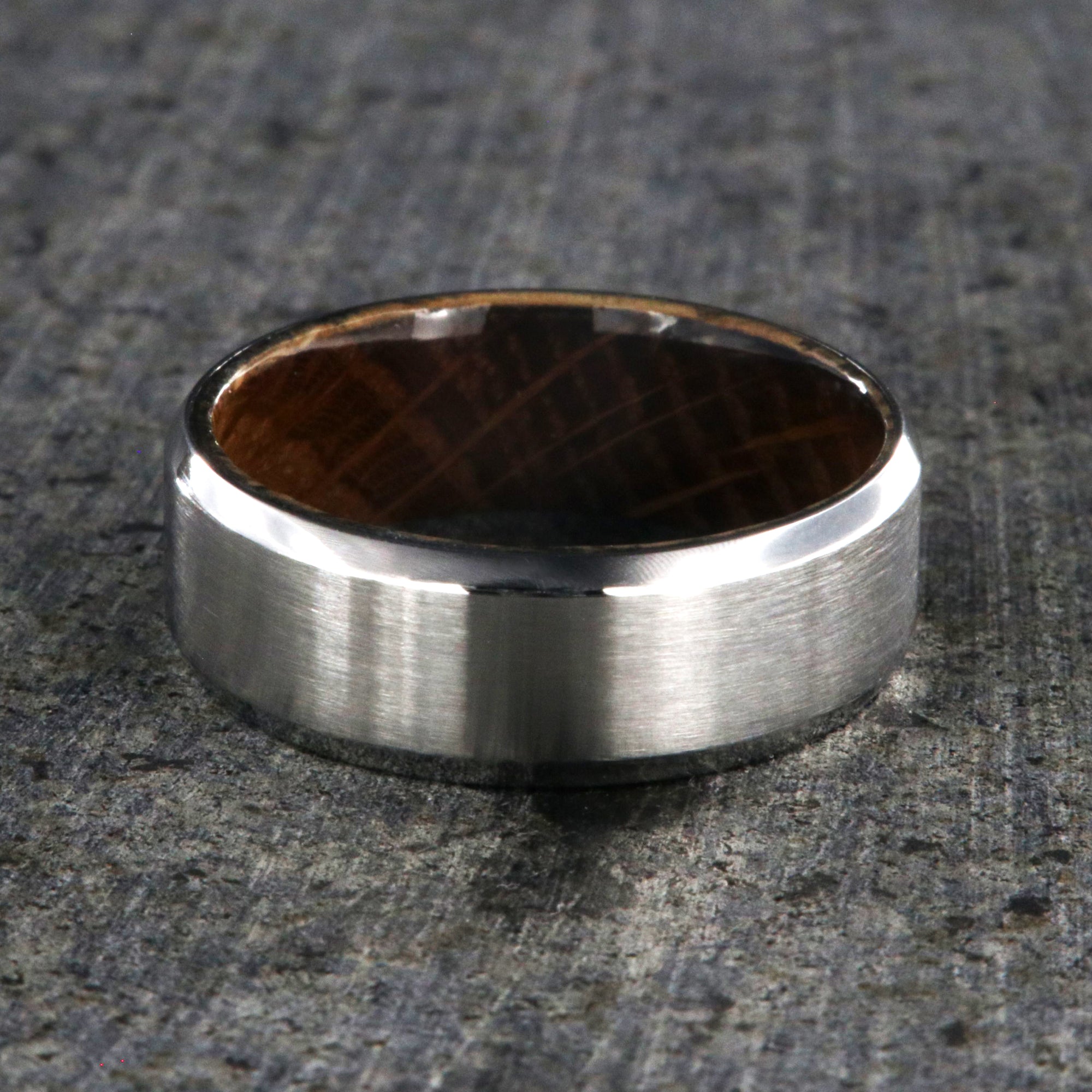 8mm wide cobalt ring with a brushed finish, beveled edges, and a whiskey barrel sleeve