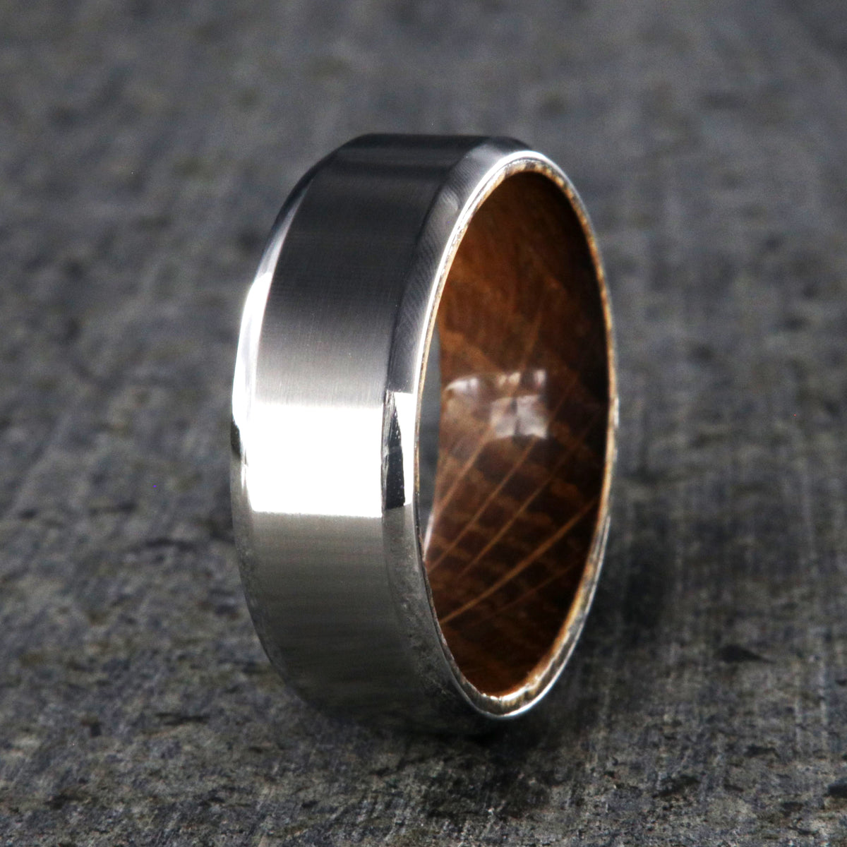 8mm wide cobalt ring with a brushed finish, beveled edges, and a whiskey barrel sleeve
