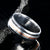 8mm wide cobalt wedding ring with dual stardust edge inlays and one center rose gold inlay