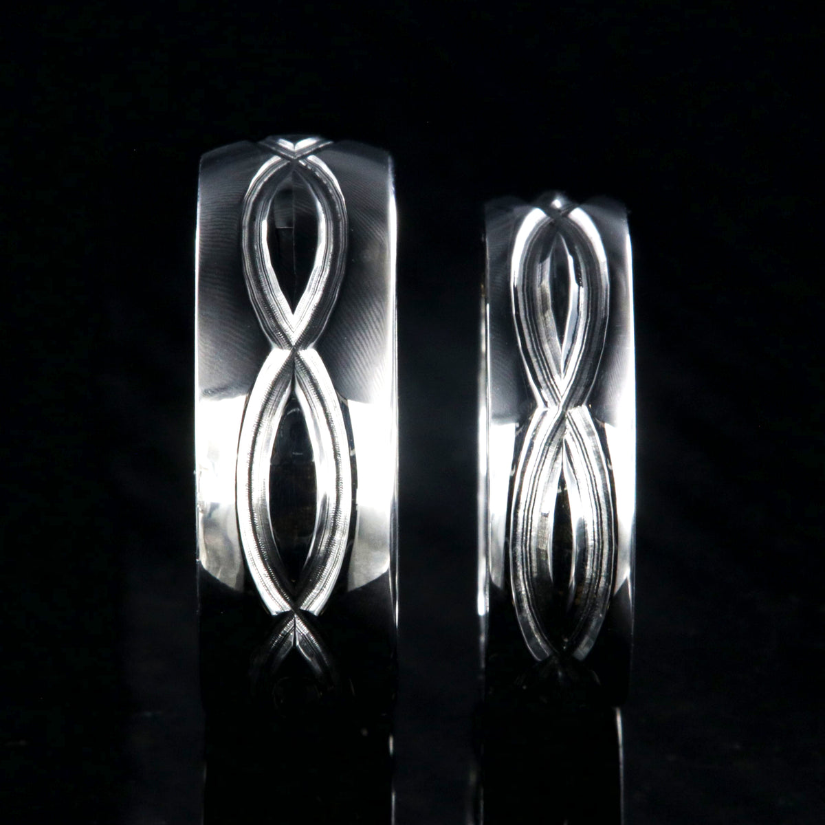 Matching infinity ring set with an 8mm and 6mm wide rings and milled infinity designs