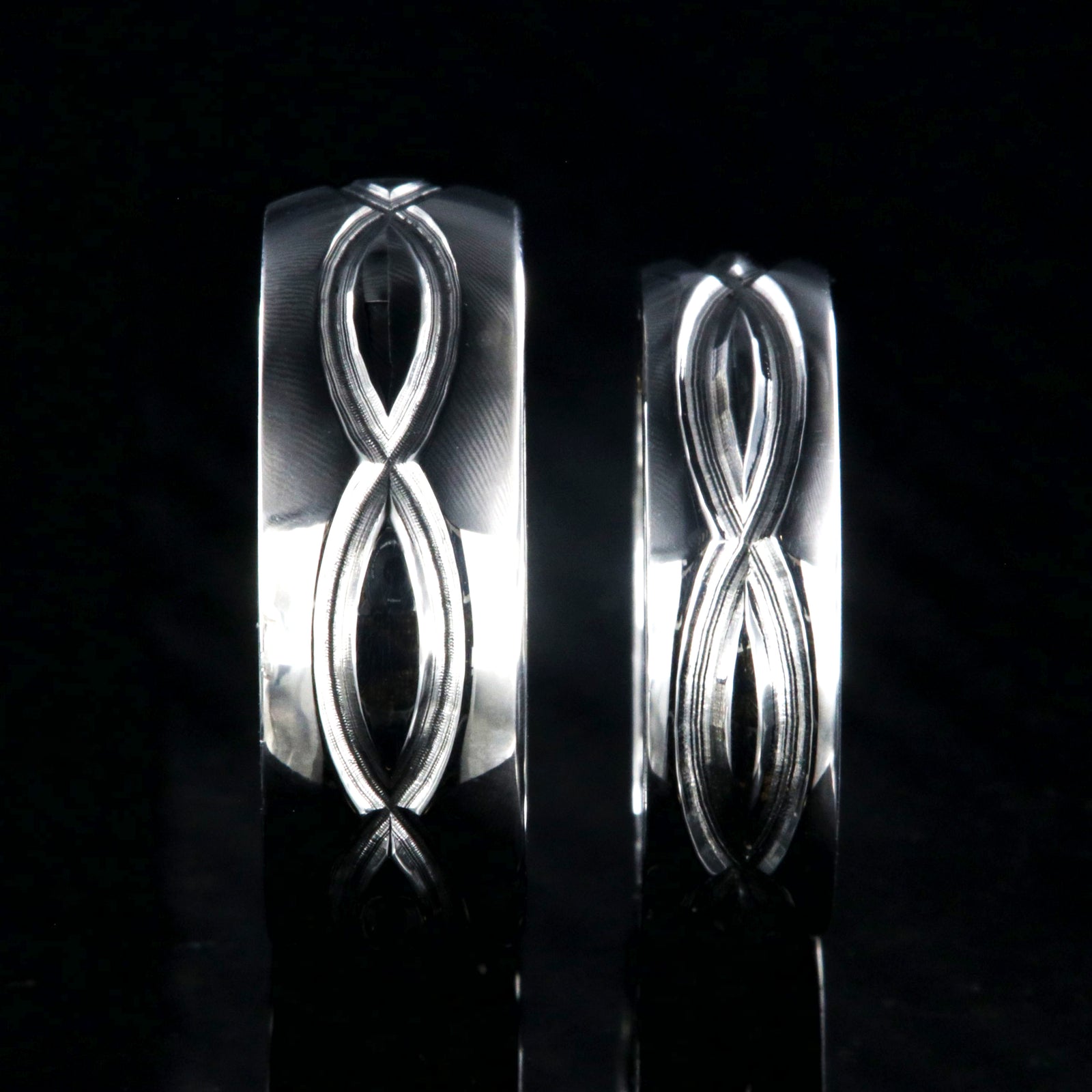 Matching infinity ring set with an 8mm and 6mm wide rings and milled infinity designs