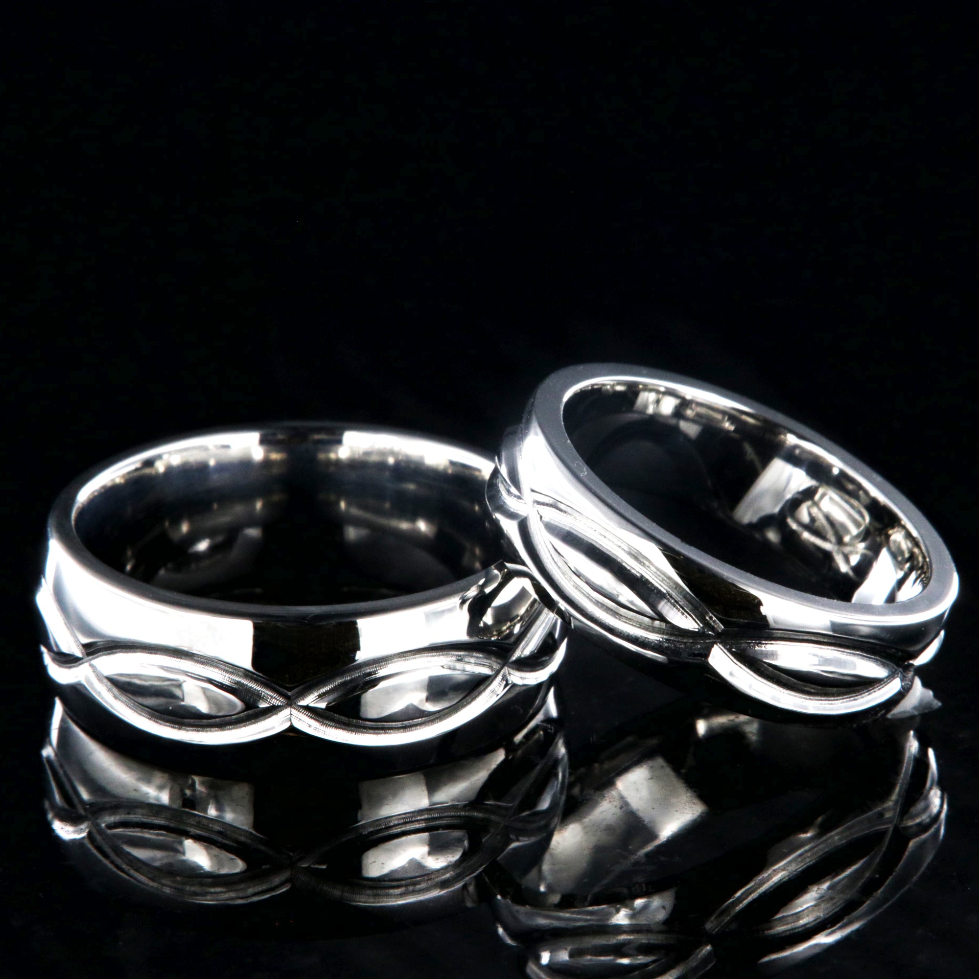 Matching infinity ring set with an 8mm and 6mm wide rings and milled infinity designs