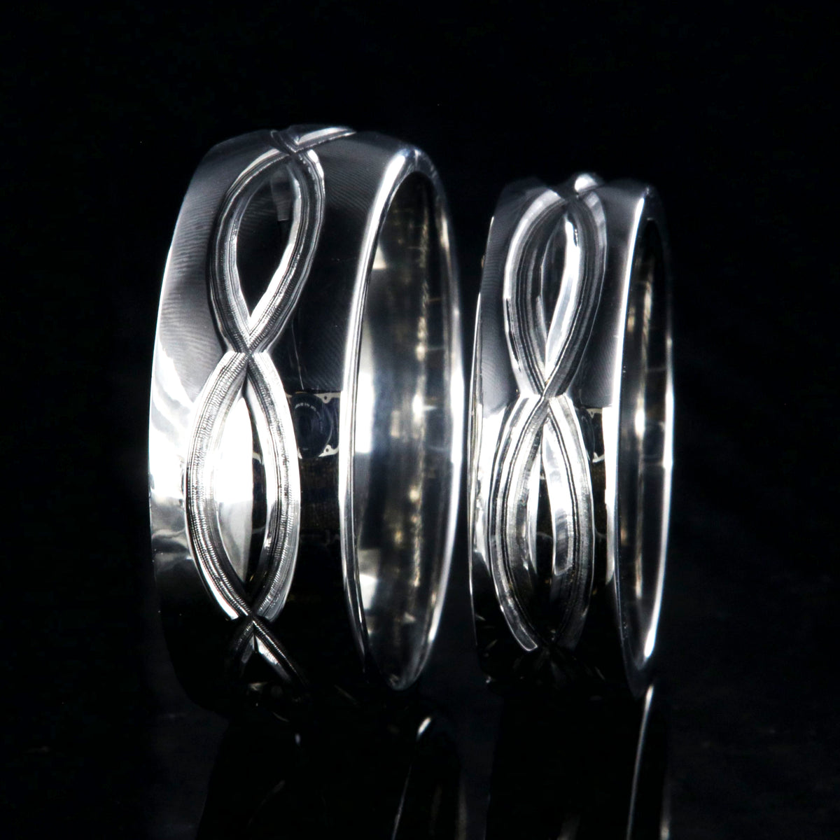Matching infinity ring set with an 8mm and 6mm wide rings and milled infinity designs