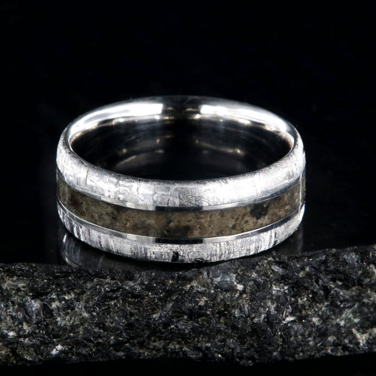 8mm wide cobalt wedding band for men with meteorite edges and dinosaur bone fossil center inlay