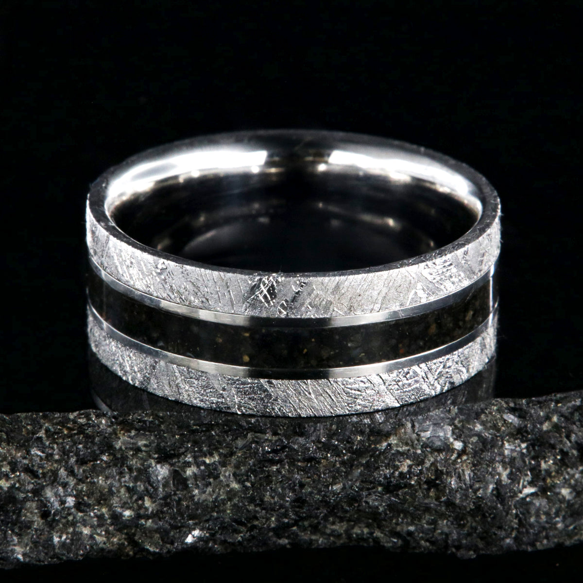 9mm wide men&#39;s wedding band with a dark dinosaur bone center inlay, Gibeon meteorite edges, and a flat profile