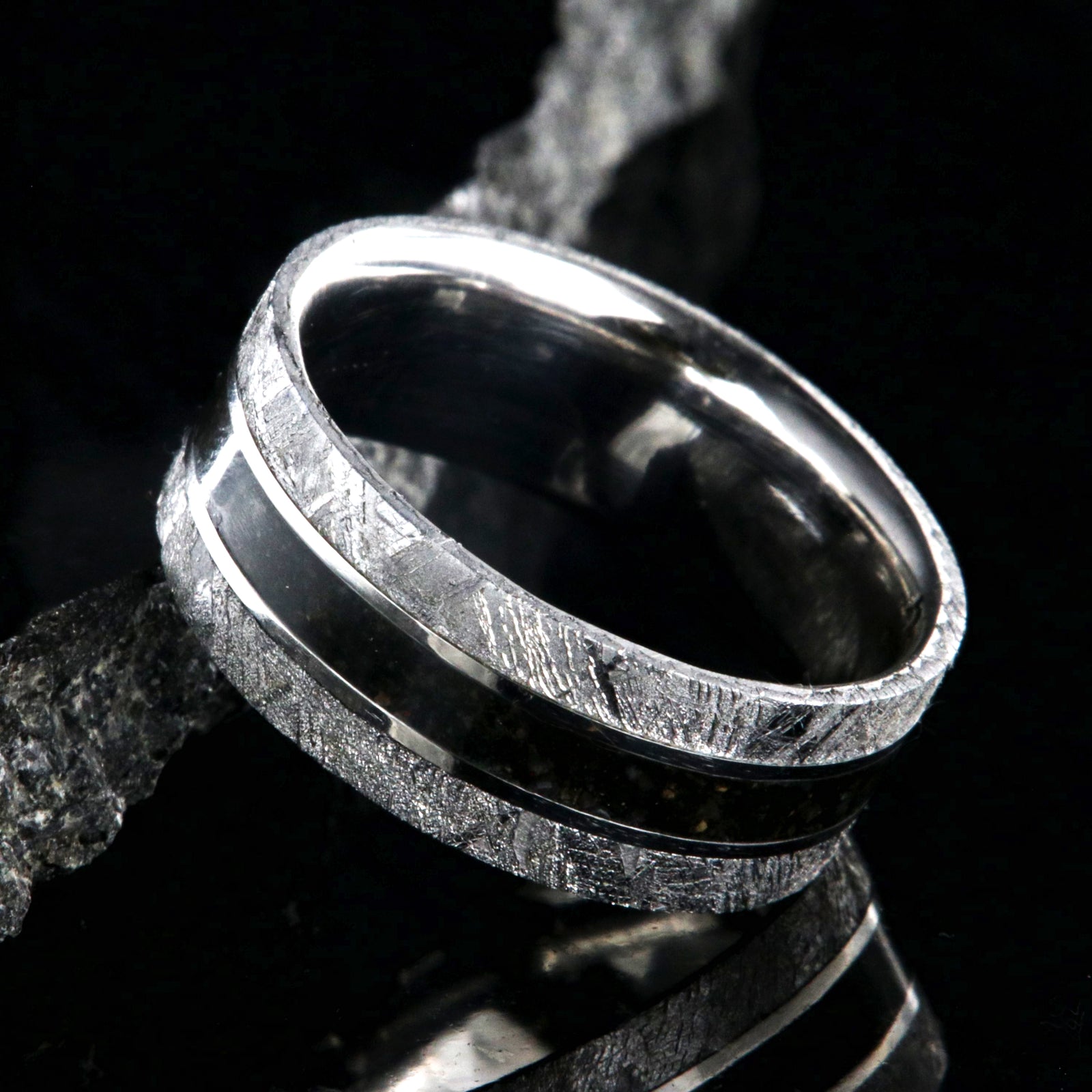 9mm wide men's wedding band with a dark dinosaur bone center inlay, Gibeon meteorite edges, and a flat profile