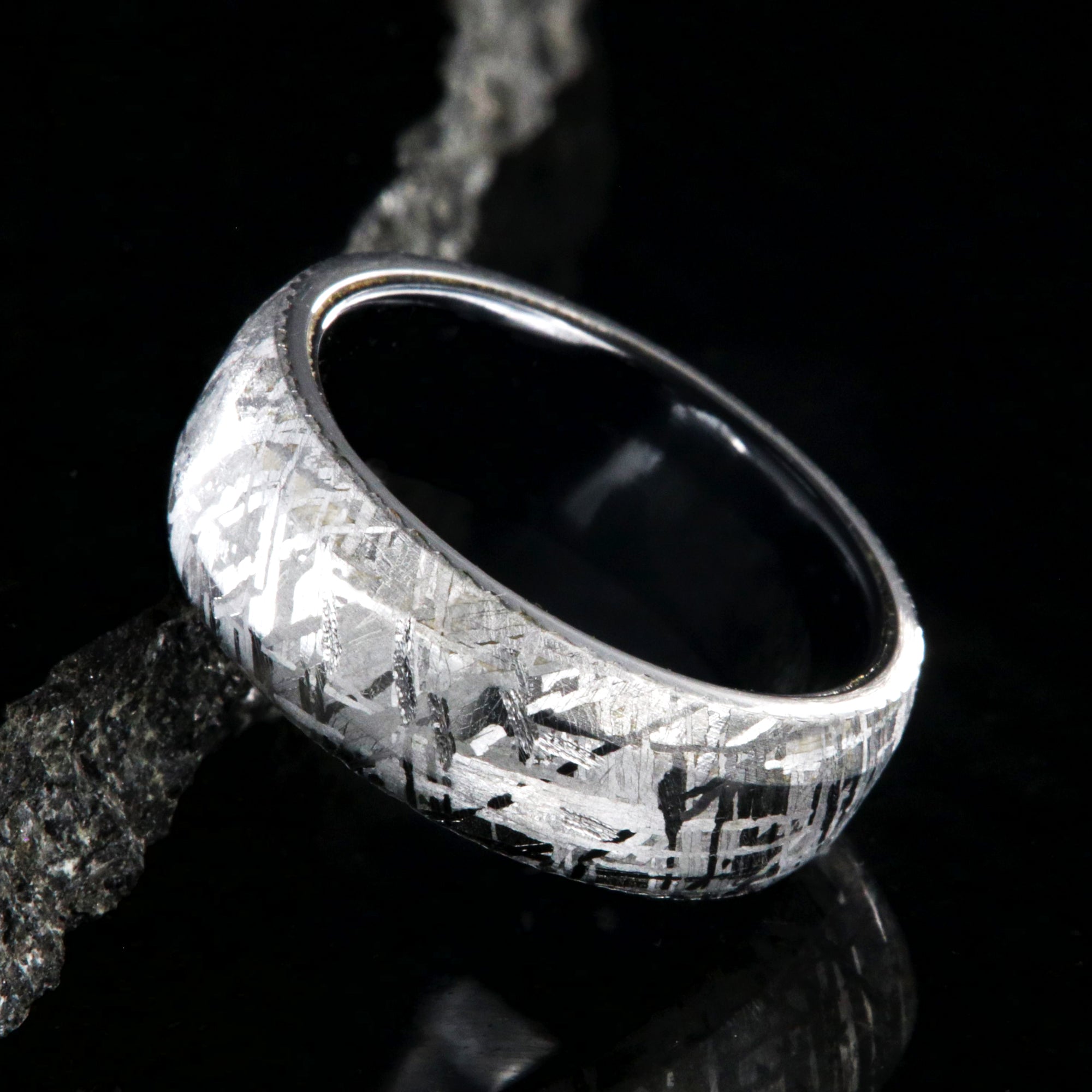 8mm wide Gibeon meteorite ring with black titanium sleeve and rounded profile