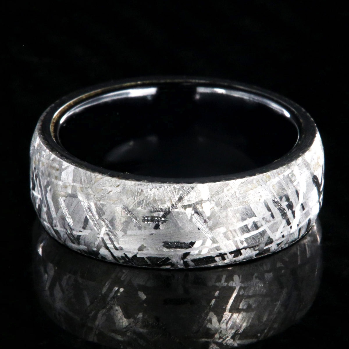 8mm wide Gibeon meteorite ring with black titanium sleeve and rounded profile