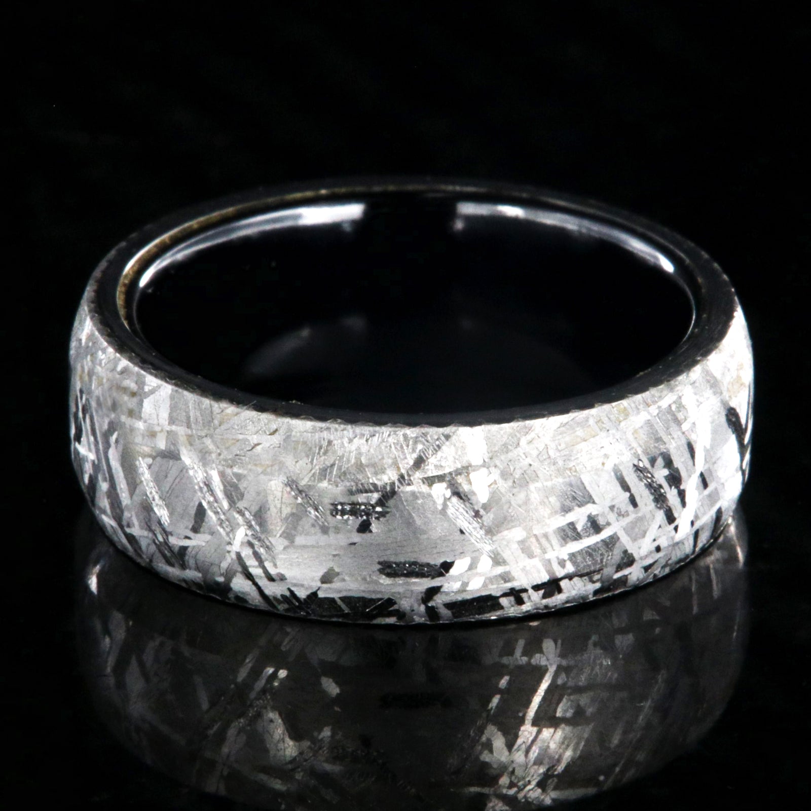 8mm wide Gibeon meteorite ring with black titanium sleeve and rounded profile
