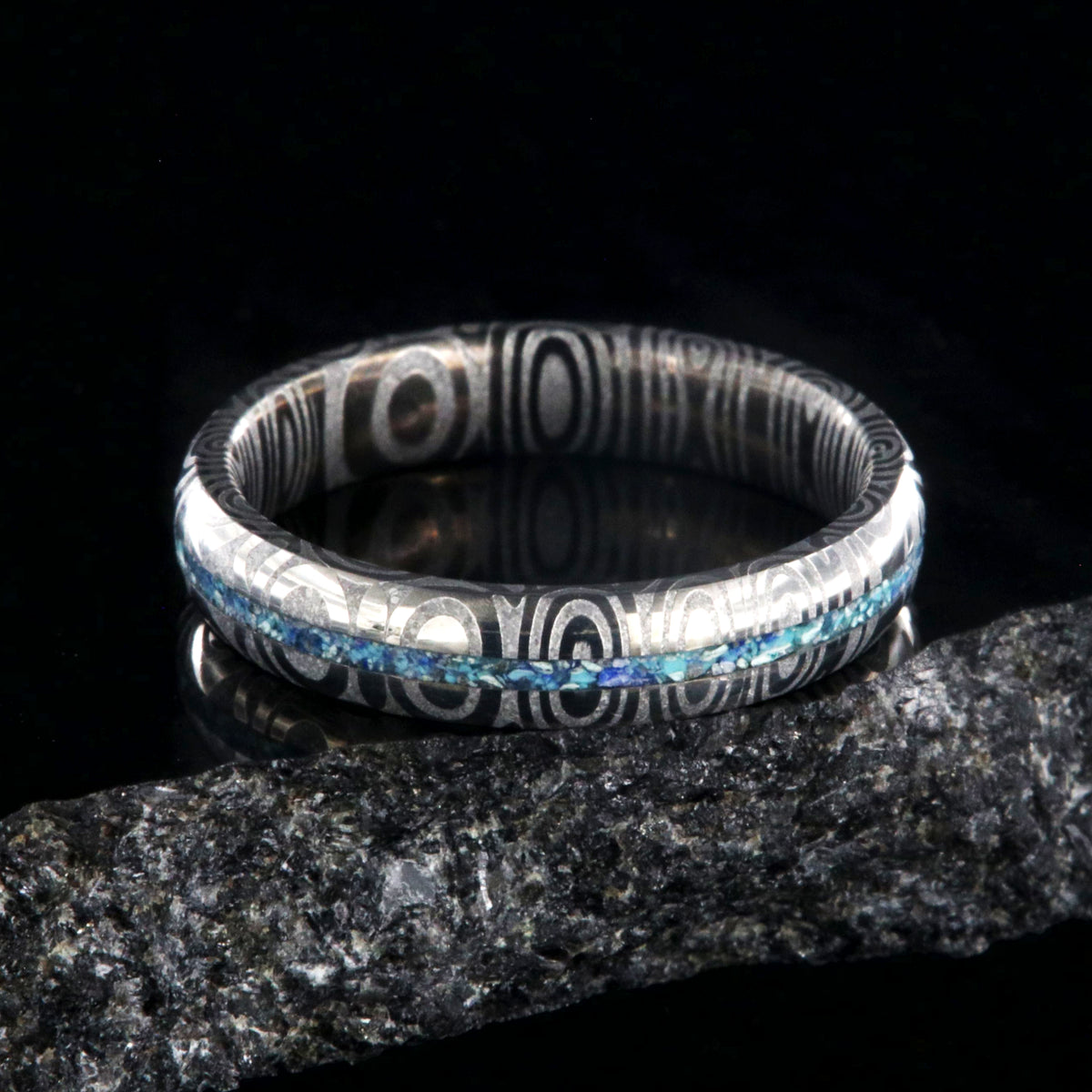 4mm wide Damascus steel ring with a turquoise and lapis lazuli inlay and a rounded profile