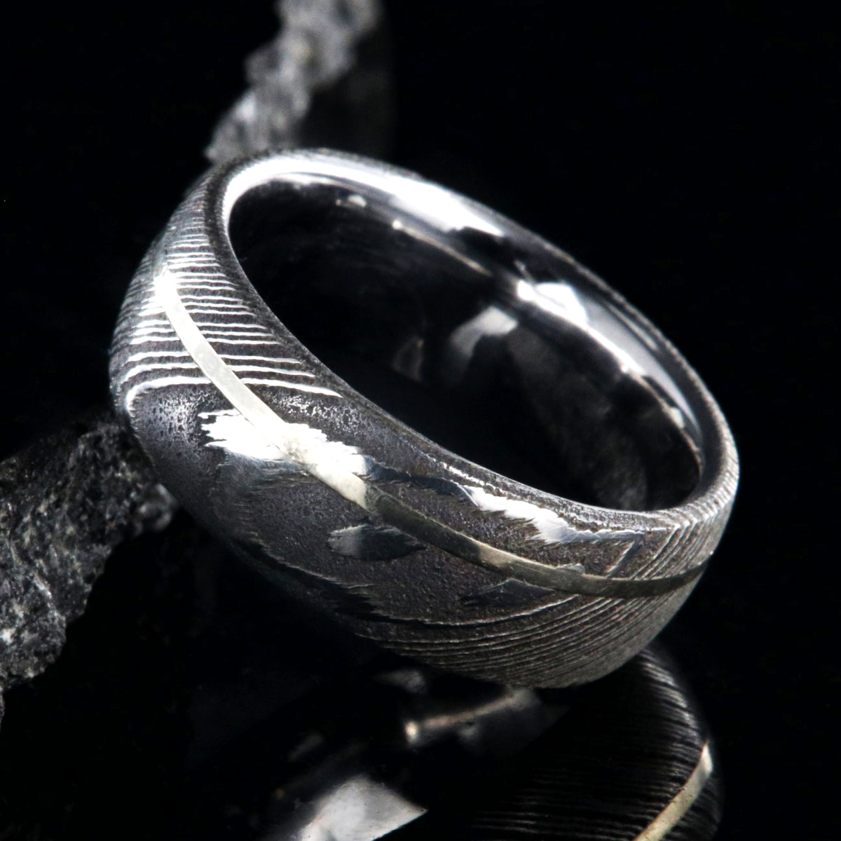 8mm wide Damascus steel ring with white gold inlay
