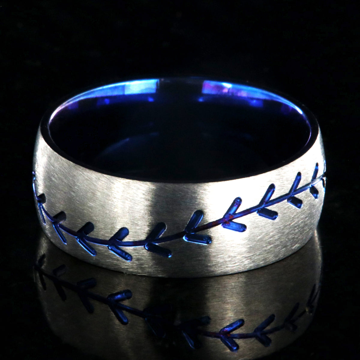 8mm wide titanium baseball ring with blue baseball stitching and a blue sleeve