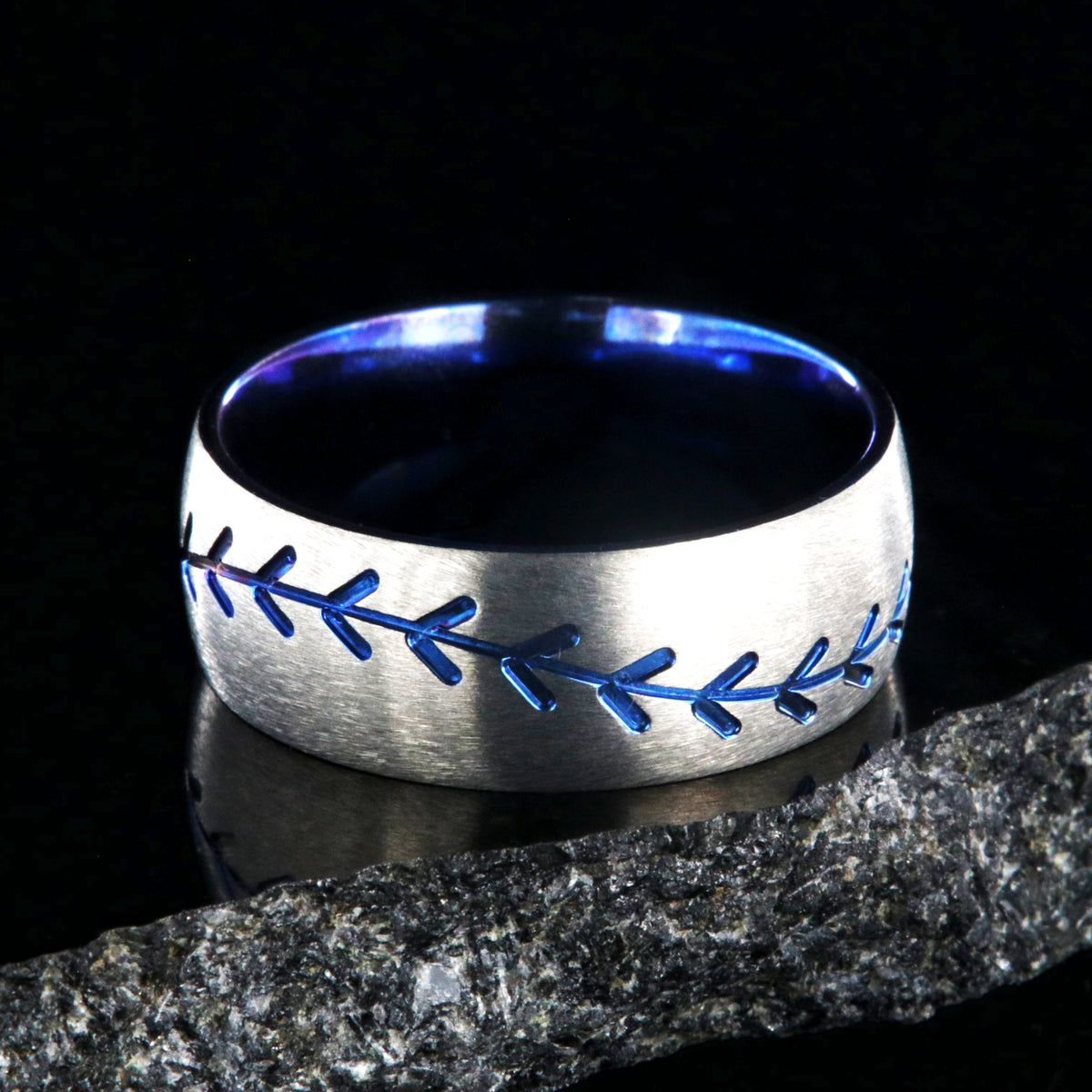 8mm wide titanium baseball ring with blue baseball stitching and a blue sleeve