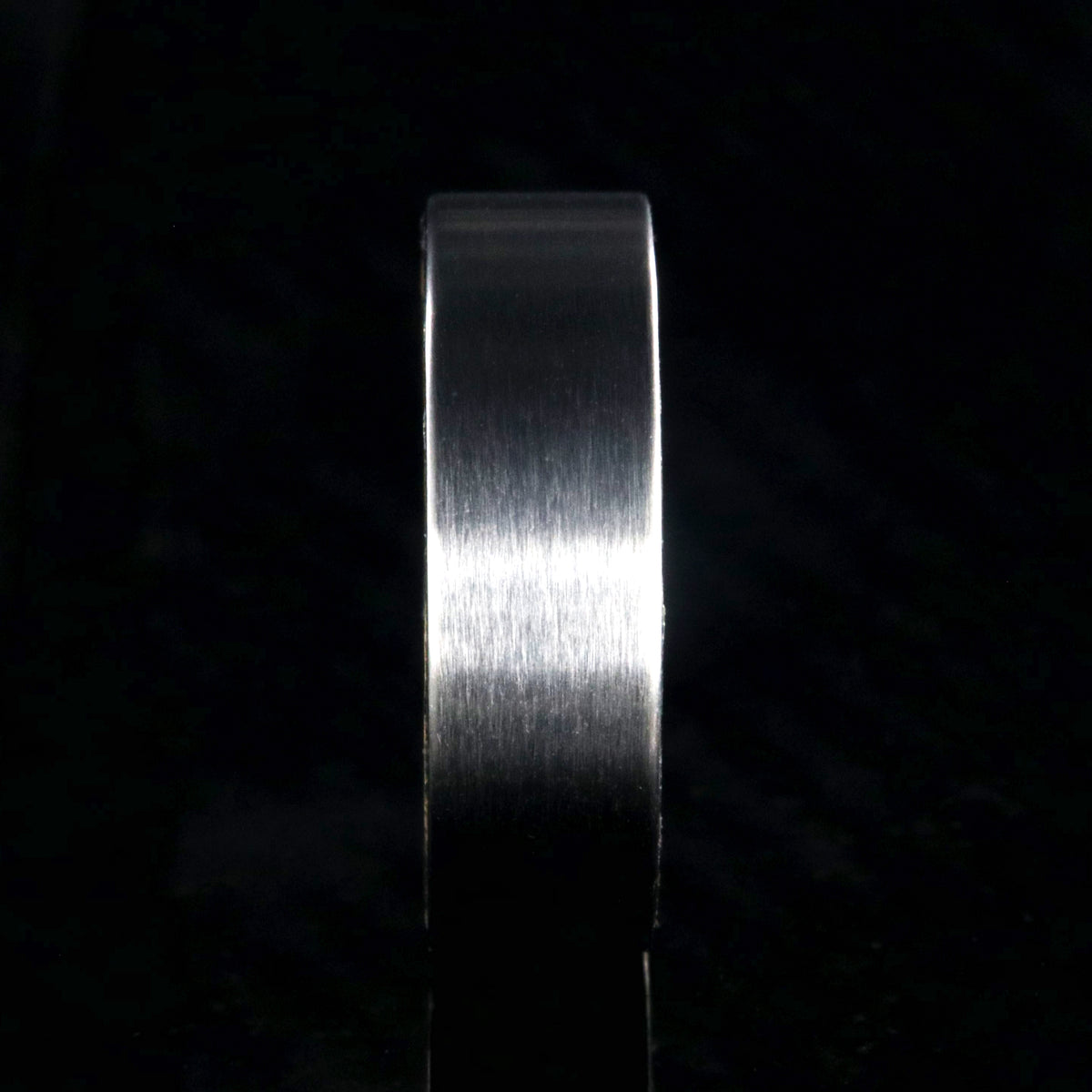 7mm wide titanium wedding band with a flat profile and whiskey barrel sleeve