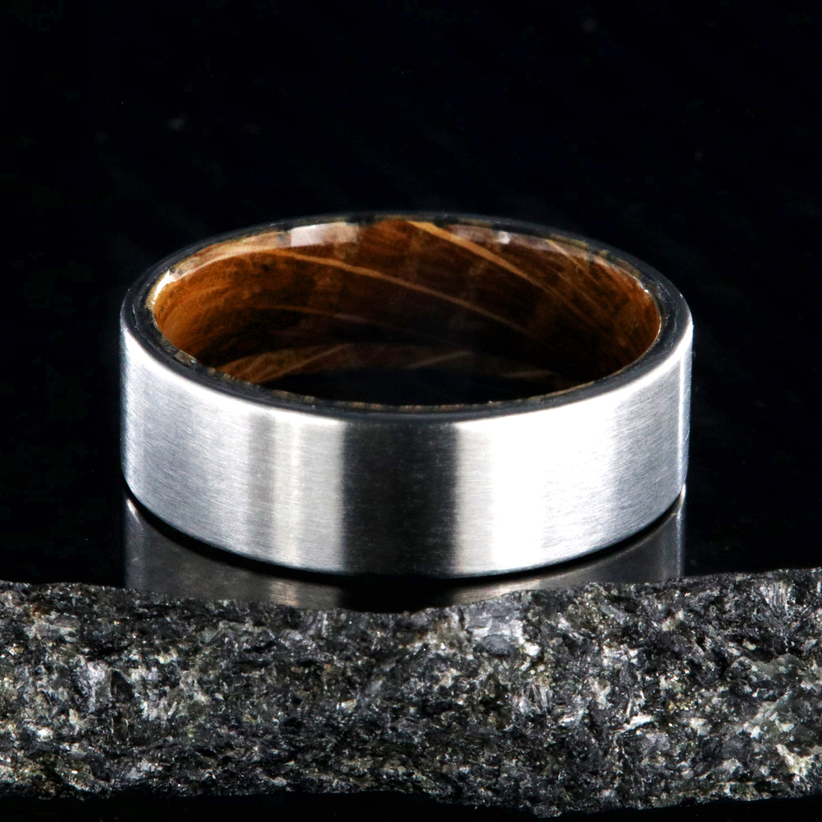 7mm wide titanium wedding band with a flat profile and whiskey barrel sleeve