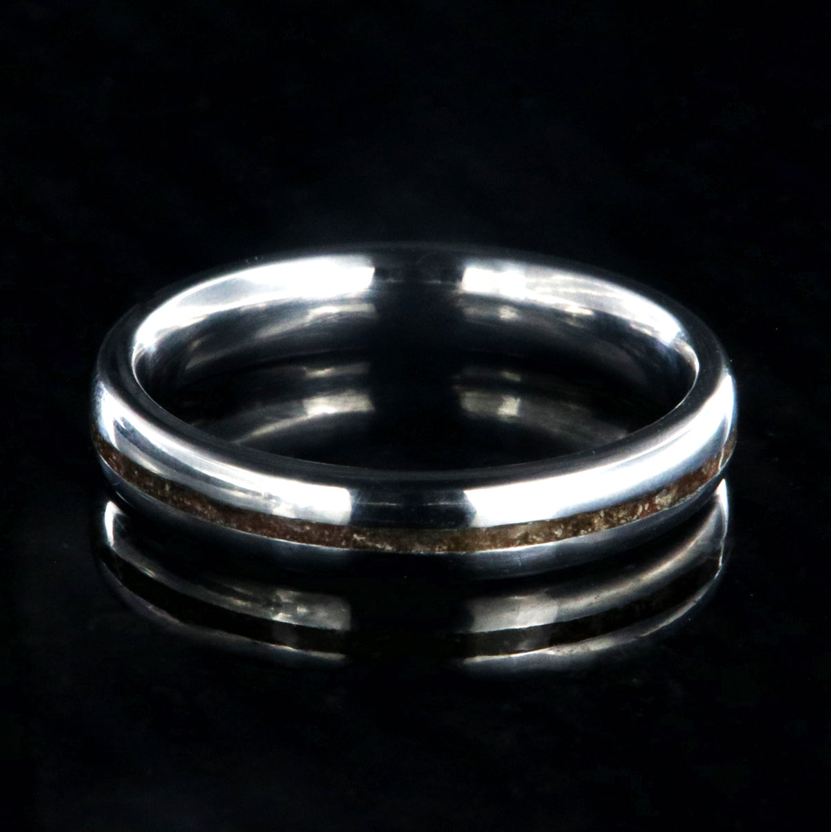 4mm wide titanium wedding band for women with a thin dinosaur bone inlay