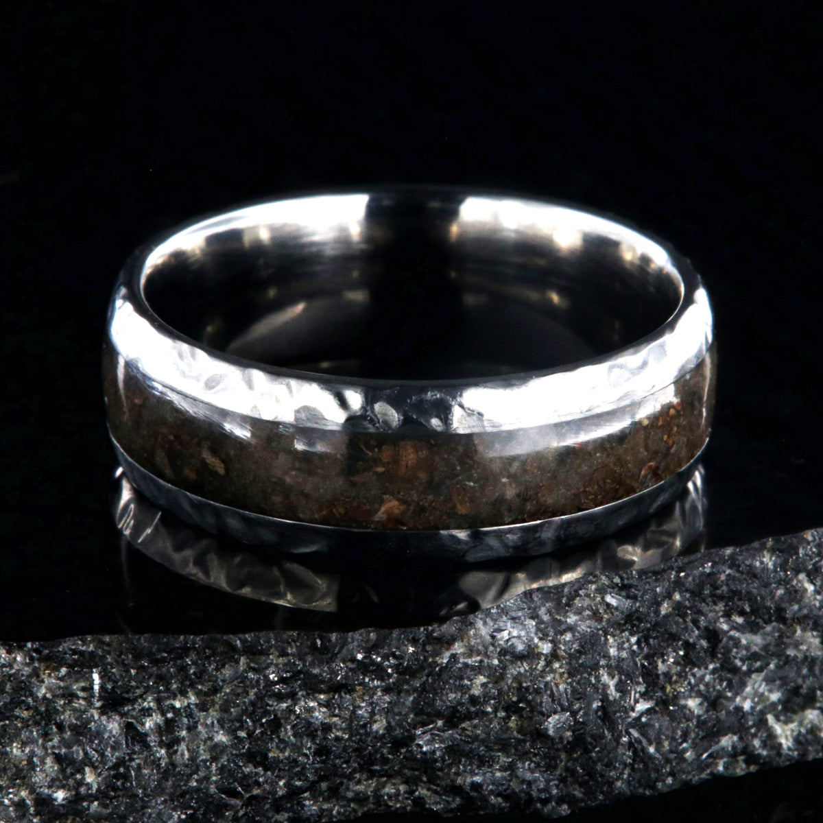 8mm wide titanium ring with hammered edges and a 4mm wide dinosaur bone inlay