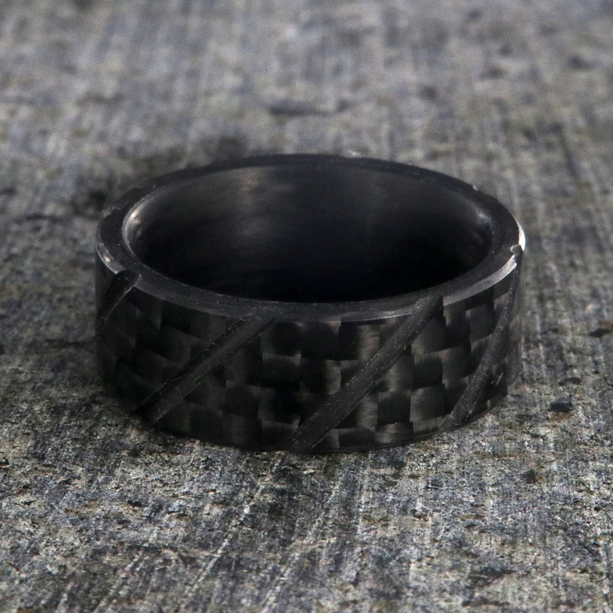 8mm wide black carbon fiber ring with diagonal grooves and a flat profile