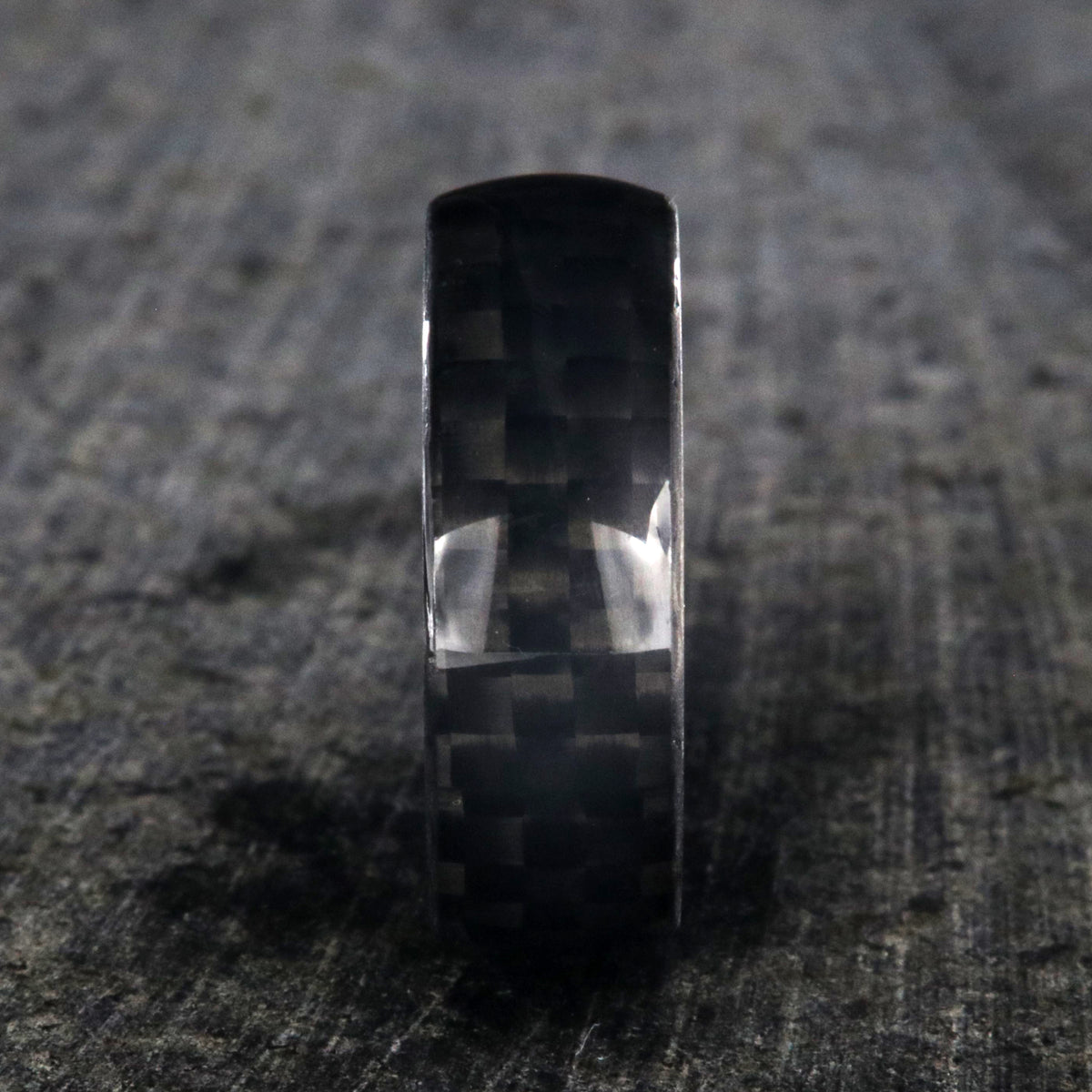 8mm wide black carbon fiber ring with a rounded profile
