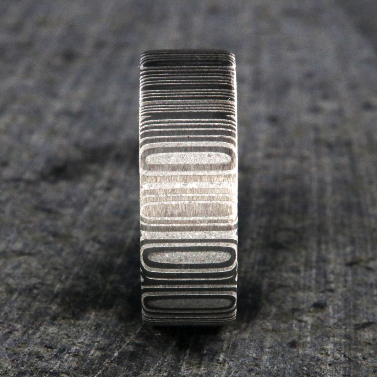 8mm wide Damascus steel wedding band with flat profile