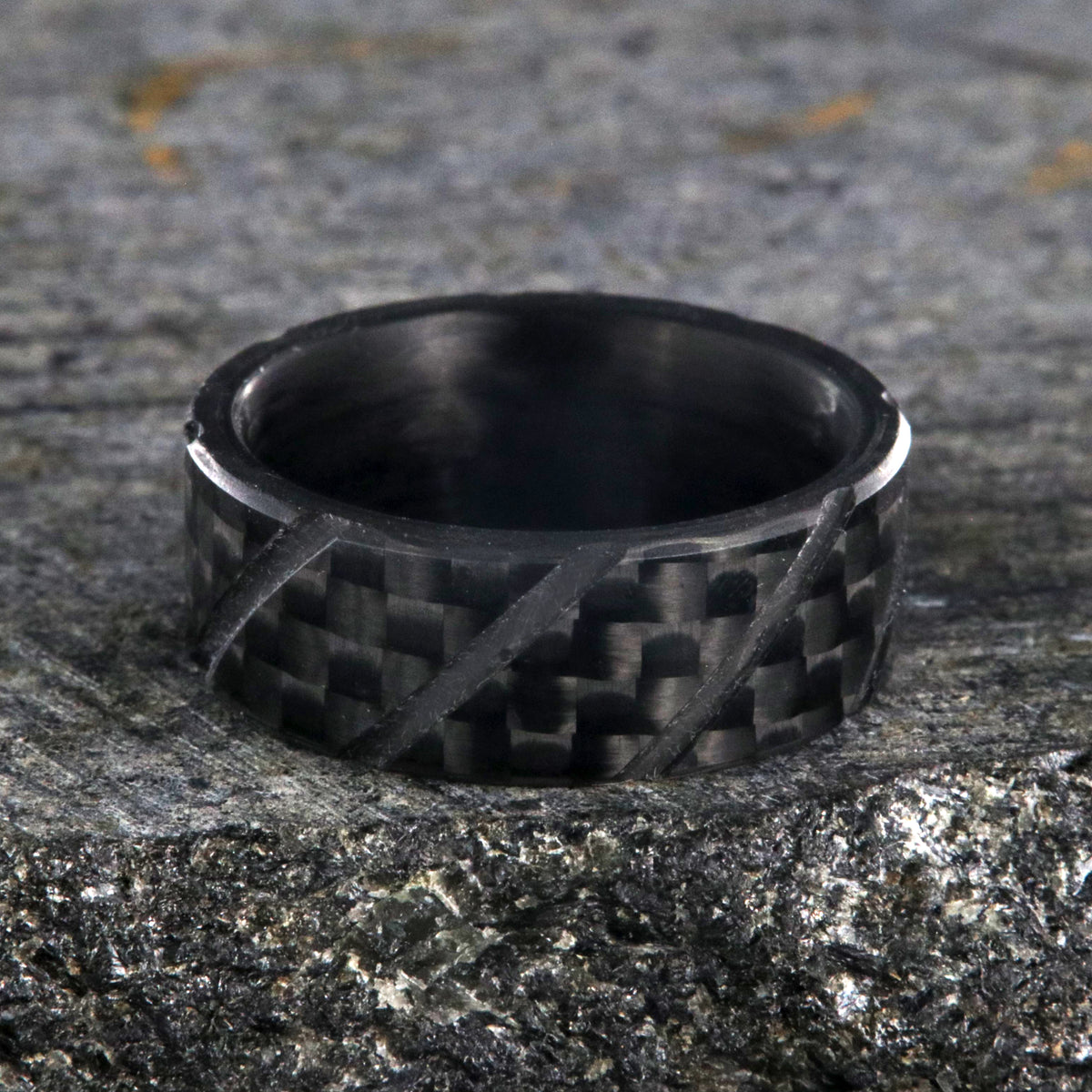 8mm wide black carbon fiber ring with diagonal grooves and a flat profile