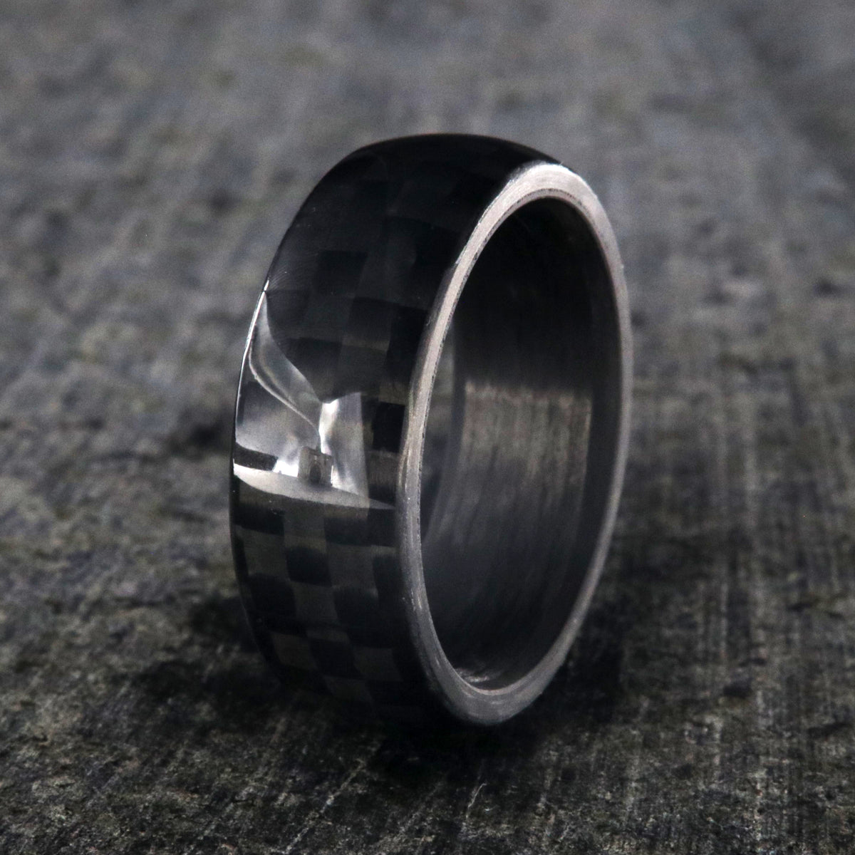 8mm wide black carbon fiber ring with a rounded profile
