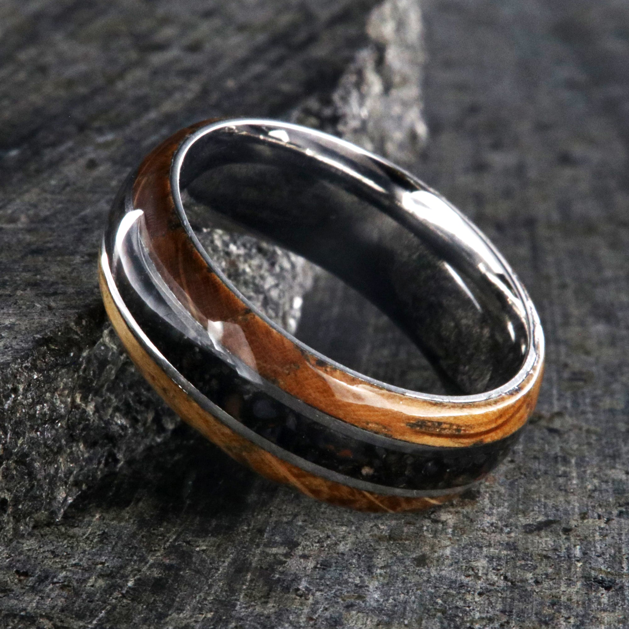 8mm wide cobalt wedding band with a center dinosaur bone inlay and whiskey barrel edges