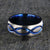 8mm wide titanium wedding band with a blue infinity design and blue sleeve