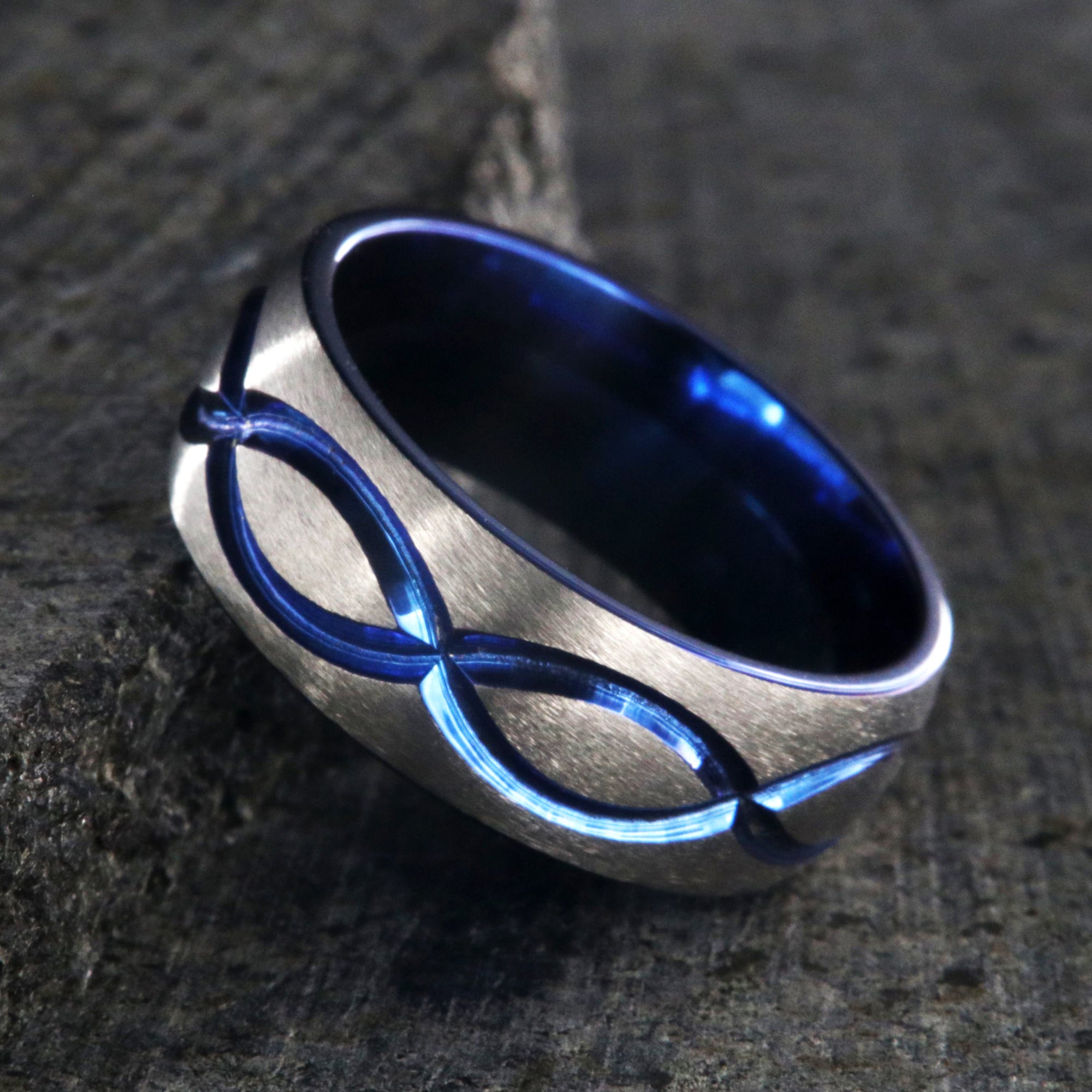 8mm wide titanium wedding band with a blue infinity design and blue sleeve
