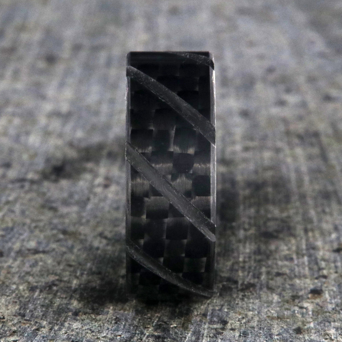 8mm wide black carbon fiber ring with diagonal grooves and a flat profile
