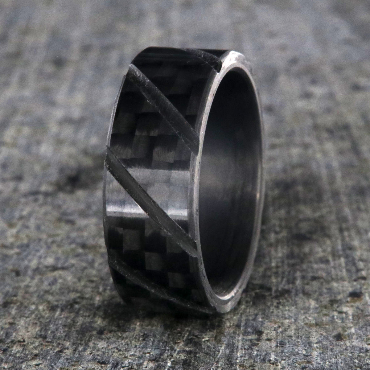 8mm wide black carbon fiber ring with diagonal grooves and a flat profile
