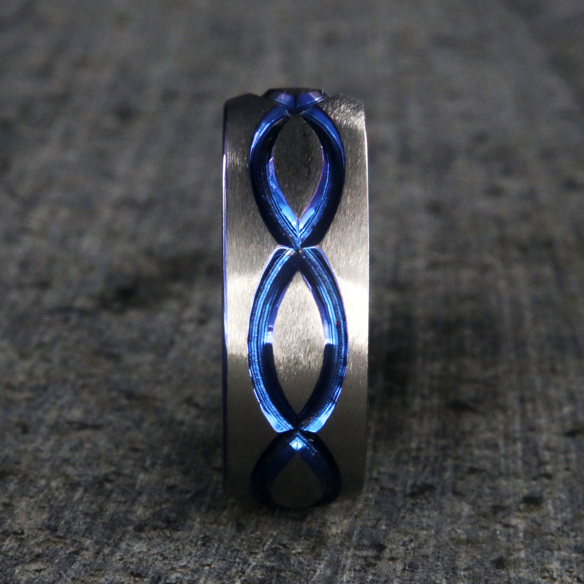 8mm wide titanium wedding band with a blue infinity design and blue sleeve