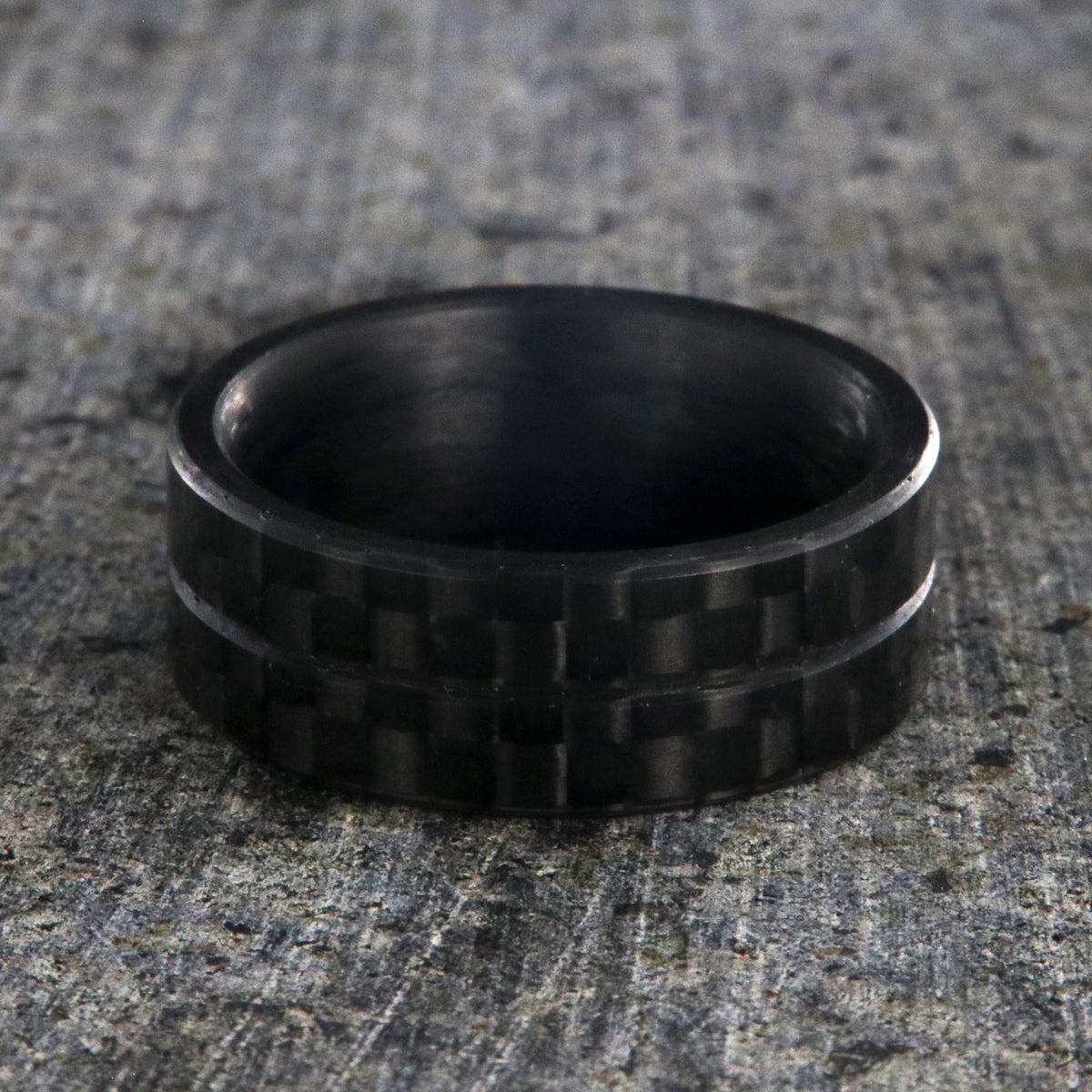 8mm wide black carbon fiber ring with a center groove and flat profile
