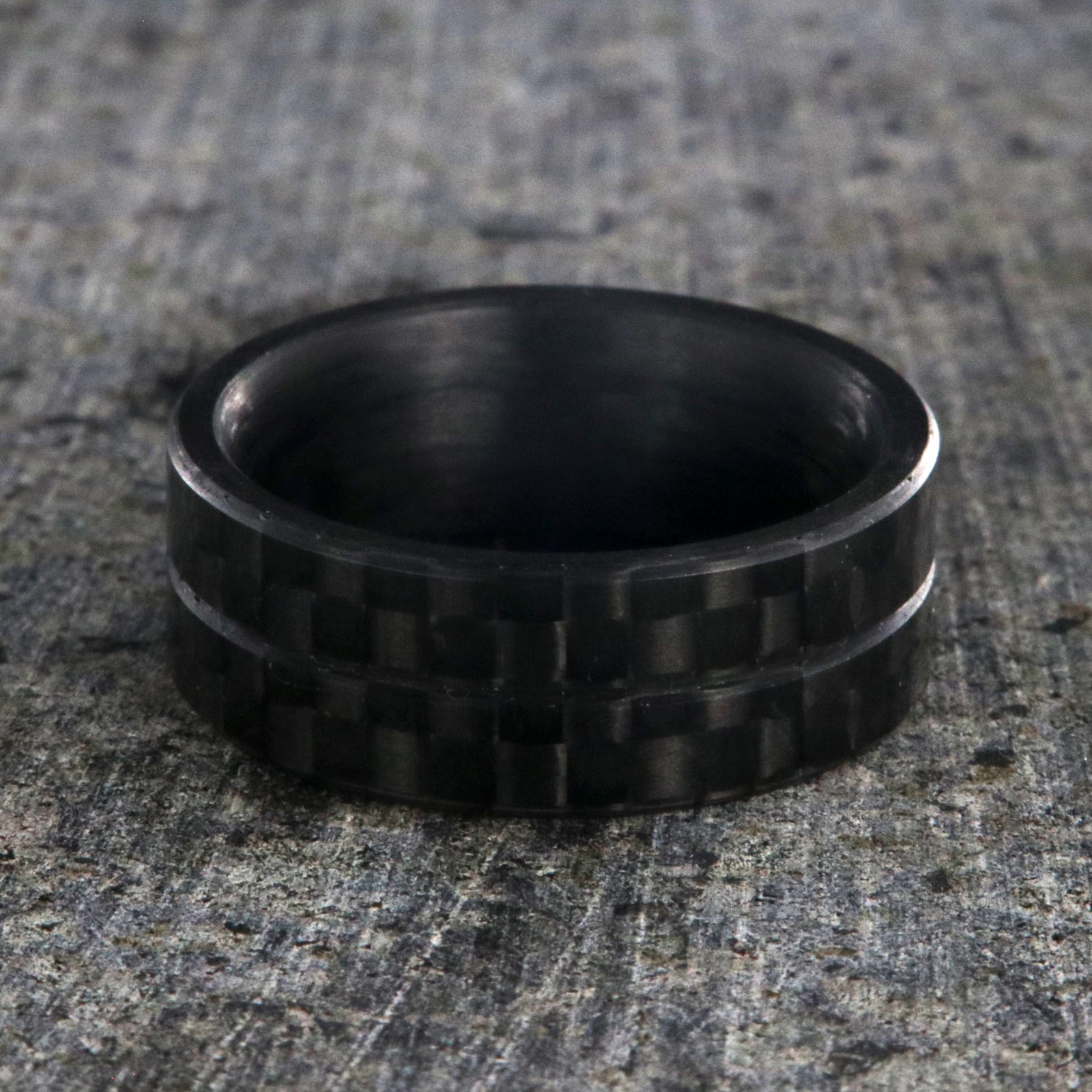 8mm wide black carbon fiber ring with a center groove and flat profile