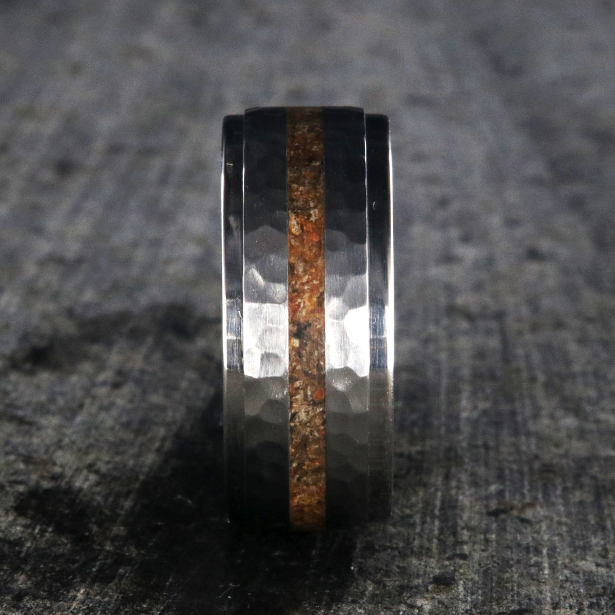 9mm wide titanium wedding band with a dinosaur bone inlay, raised center, and hammered texture