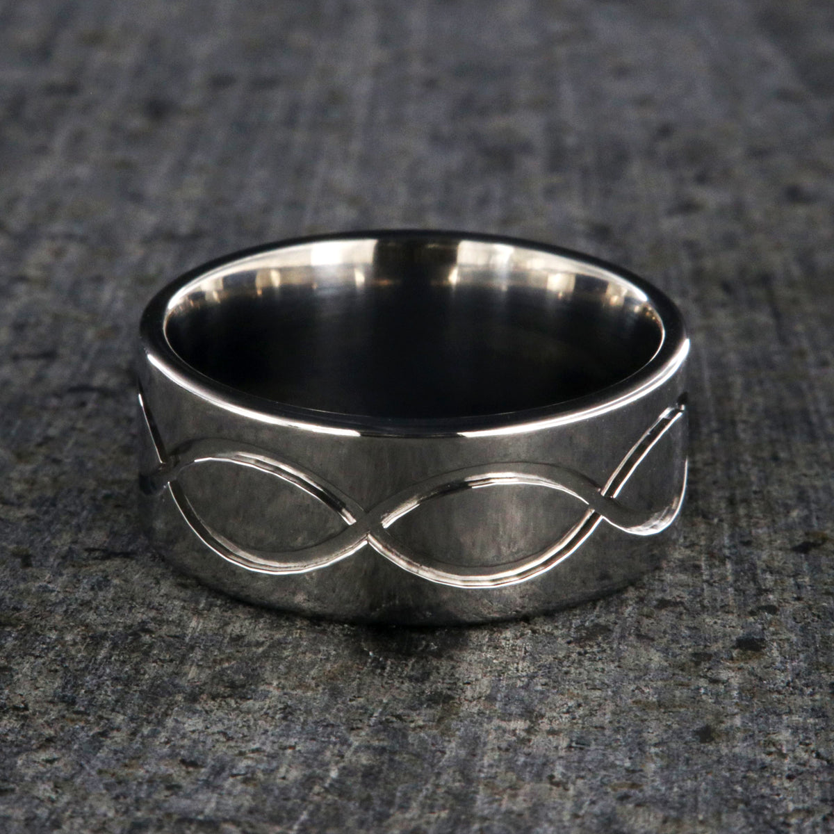 9mm wide titanium wedding band with a milled infinity design and flat profile