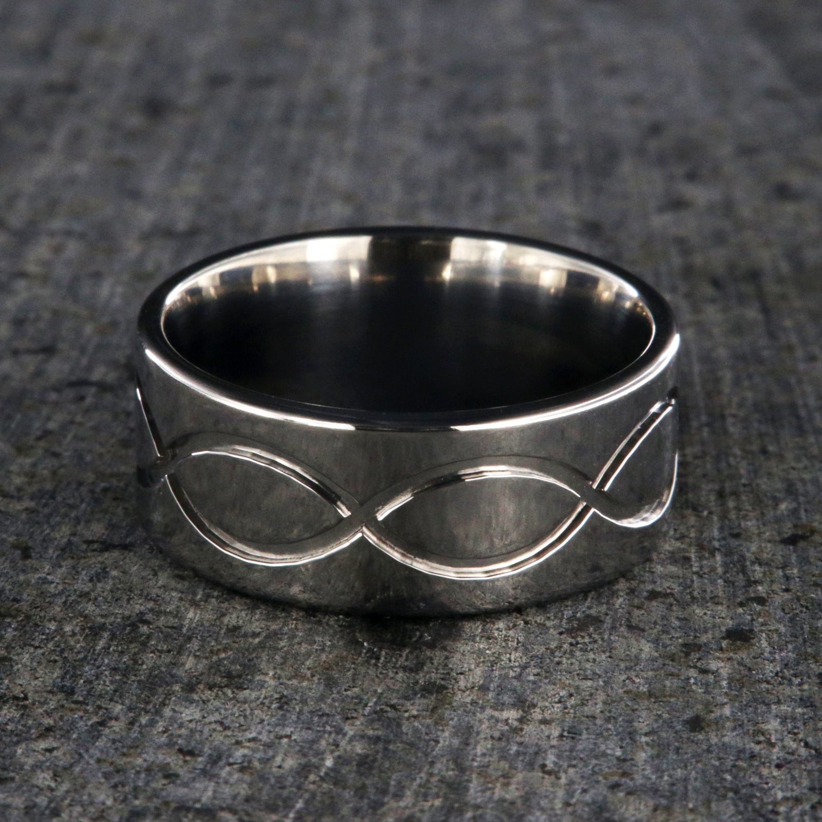9mm wide titanium wedding band with a milled infinity design and flat profile