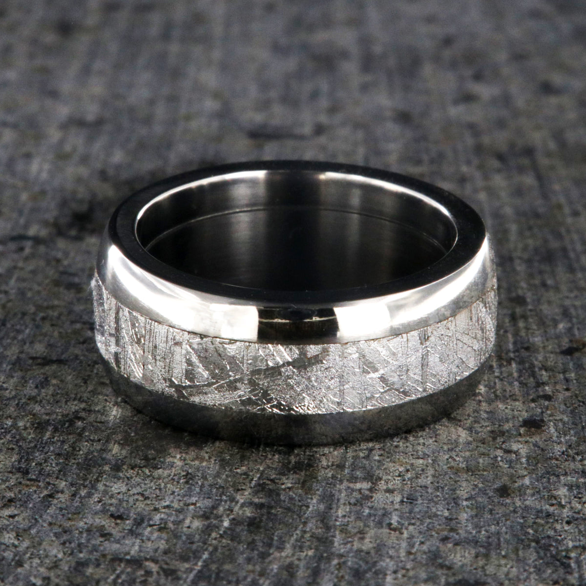 8mm wide Muonionalusta meteorite wedding band with titanium edges and sleeve