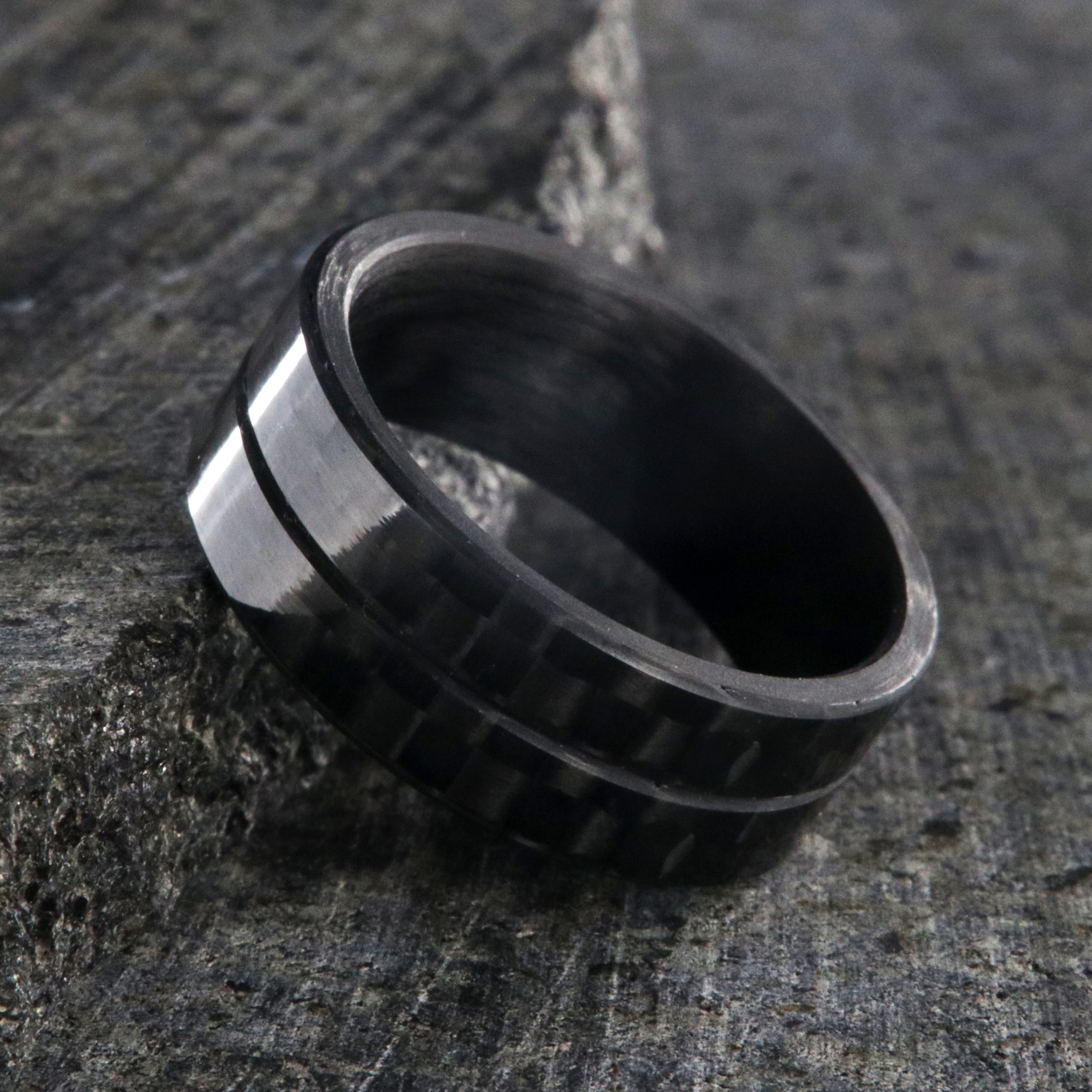 8mm wide black carbon fiber ring with a center groove and flat profile