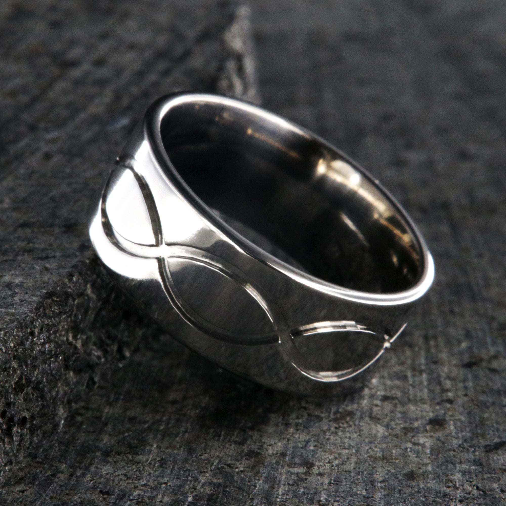 9mm wide titanium wedding band with a milled infinity design and flat profile