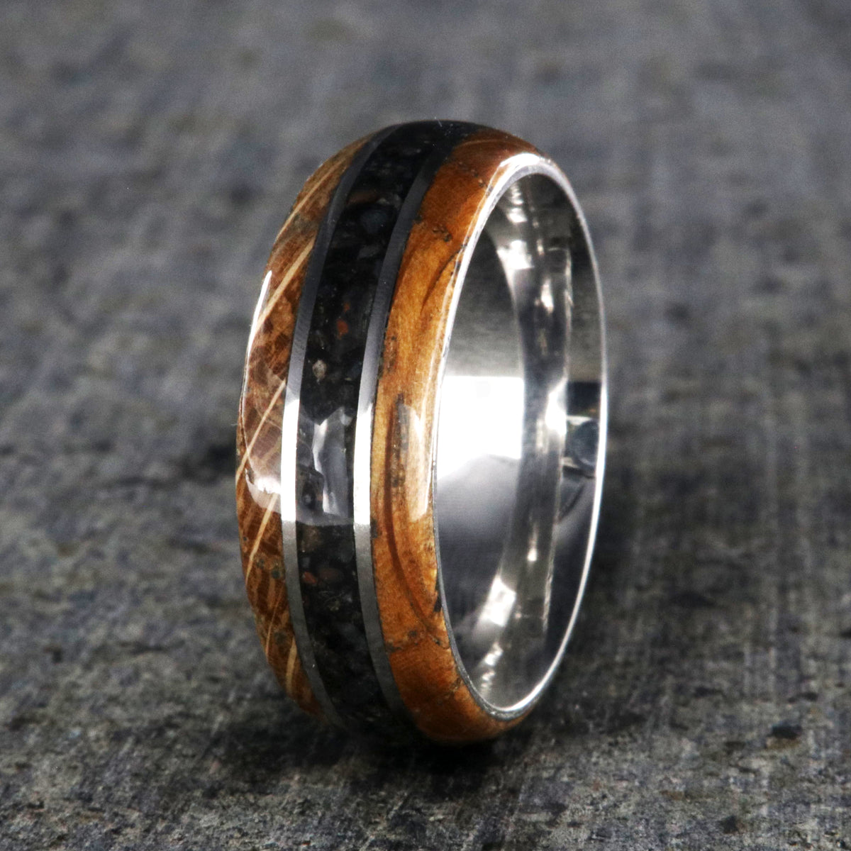 8mm wide cobalt wedding band with a center dinosaur bone inlay and whiskey barrel edges